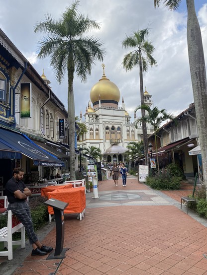 Sultan Mosque in Singapore, facing a street with restaurants