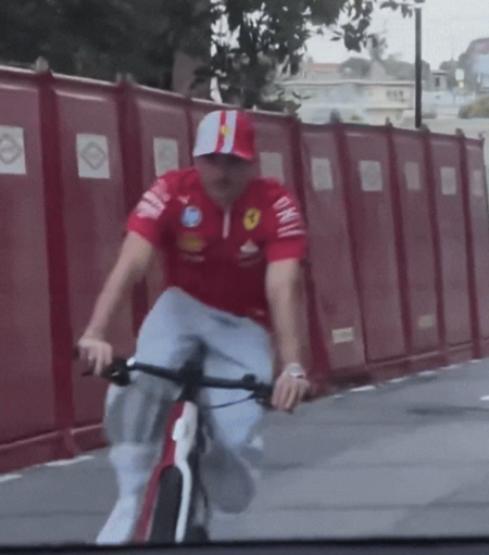 Ferrari driver Charles Leclerc on a bike in the streets of Monaco